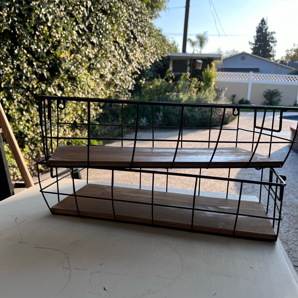 pair of metal and wood hanging baskets